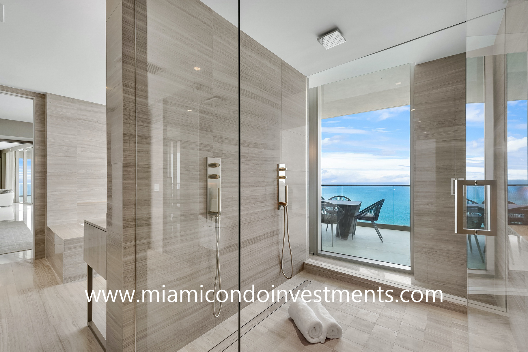 glass-enclosed shower with direct ocean views